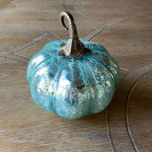Teal light up glass pumpkin with a silver metal stem